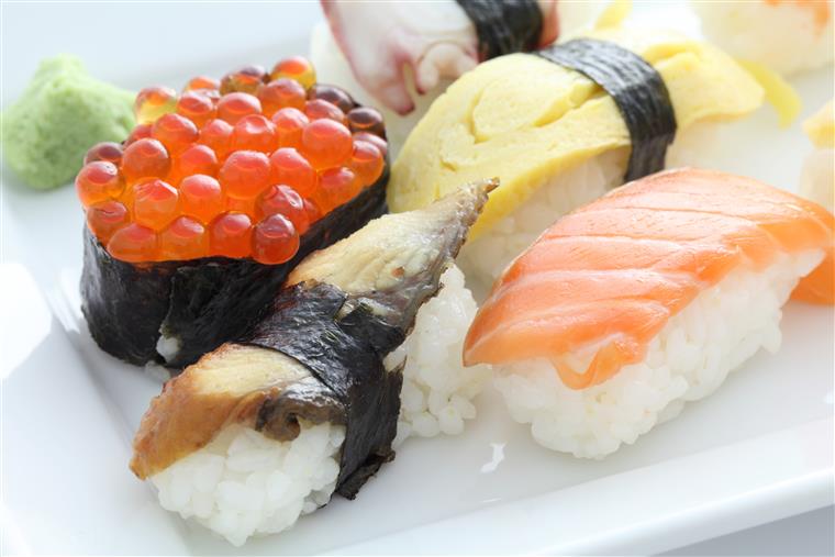 assorted sushi in a white plate